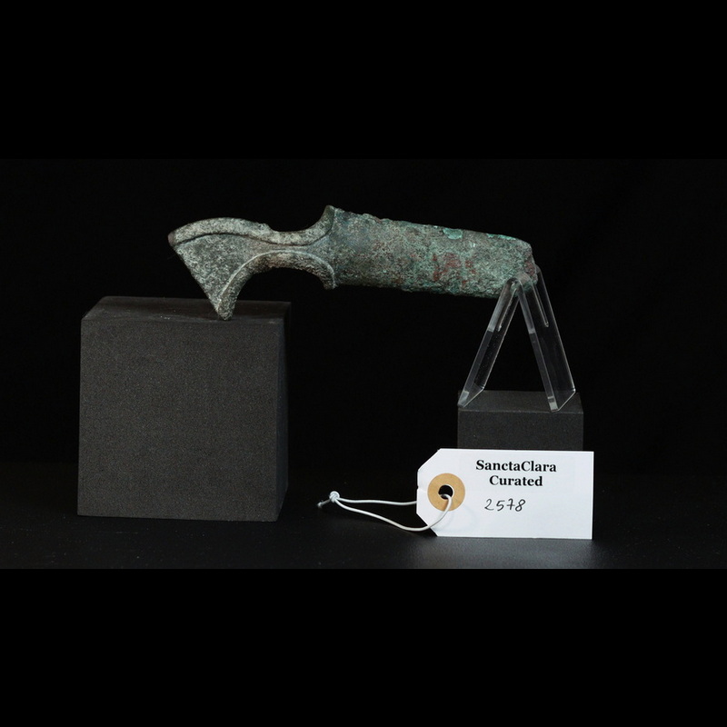 Bronze axe head patinated and corroded