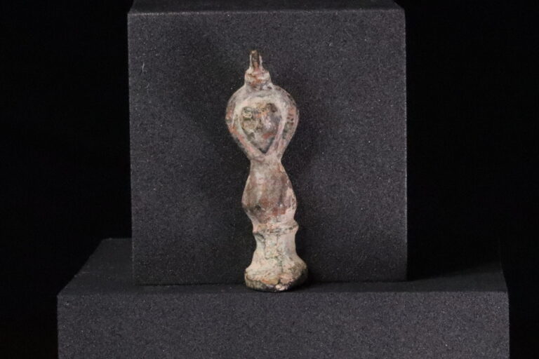 Figurine of a hooded god