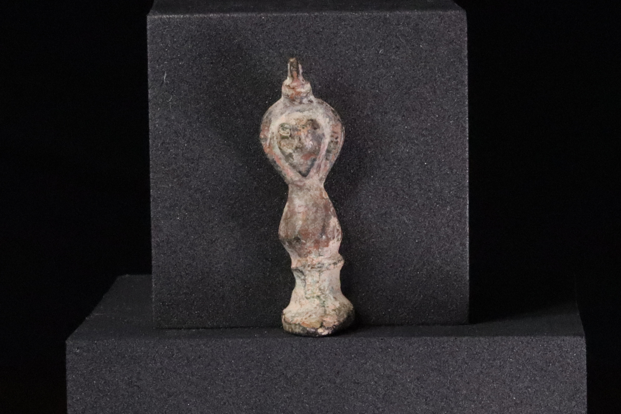 Figurine of a hooded god